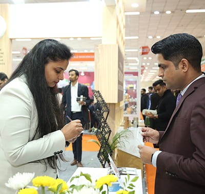 Visitor inspecting product at Vitafoods India